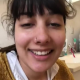 A very cute girl shits into a toilet from under ass. Limited hang with product in the bowl. Brief clip. Filmed from a between the legs perspective. Vertical format video. Under a minute.
